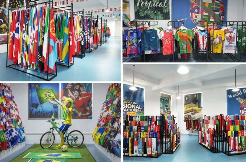 Factory showroom with national flags, fan scarves, and jerseys on display